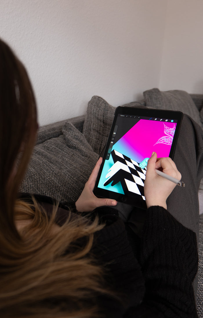 Artist drawing the Cocktail Sun illustration on an iPad